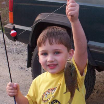 Billy Mirenda from Middletown, N.Y. He is holding a nice sunfish he caught from a pond