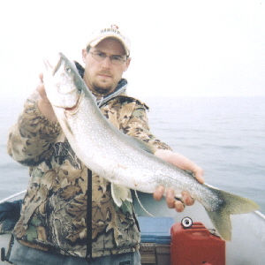 Justin otherwise known as Bling Bling from Newfoundland PA. is holding a nice lake trout taken from Seneca Lake in May 2004