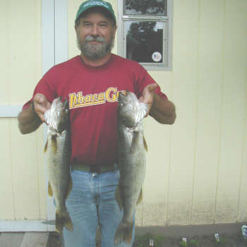 Charlie Goodberlet from Manchester, NY displays two nice walleyes that measured in at 21 and 24 inches