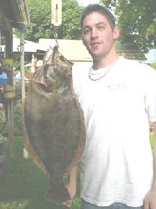 Pictured here is Richard S. Hanke. He is  holding a very nice fluke that weighed  8 pounds and was  25 inches in length.