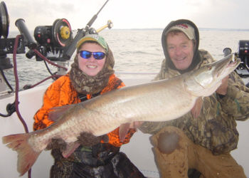 Kenny Hemshrot and Ernie Lantiegne with a 50 and 1/4 inch Muskellunge which was safely released