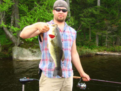 Matt Sciortino with a  huge largemouth bass from Raquette Lake in Hamilton County NY