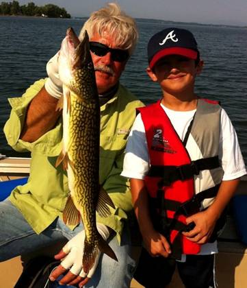 This beautiful chain pickerel was landed by Matthew while on a birthday fishing charter with Captain Mick