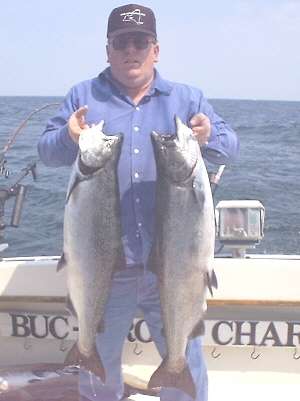 Raymond Martin of Elmira, N.Y. was fishing aboard the BUC-A- ROO The two nice salmon in the photo were taken on Spin Doctor Rotating Flashers with no-see-um Fly run behind a Dipsy Diver set out at between 150 and 200 feet