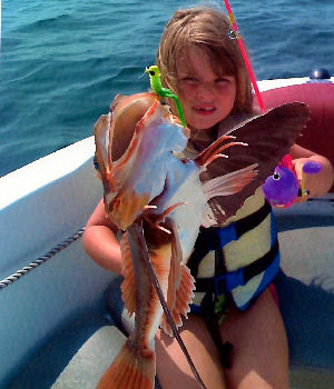 Autumn Jean Markle with a Sea Robin she caught on her Barbie doll fishing pole