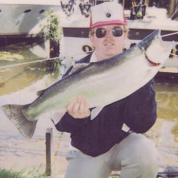 Raymond Martin is pictured here with a 16 pound Lake Ontario Steelhead. This fish was caught in mid August about 6 miles off shore in lake Ontario's western basin