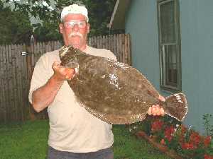 The date was August 10, 2003 when Victor Calkins of Blackwood N.J. was able to hook and land this 11 pound Fluke outside the Breeze- Lee  marina in Cape May, N.J.